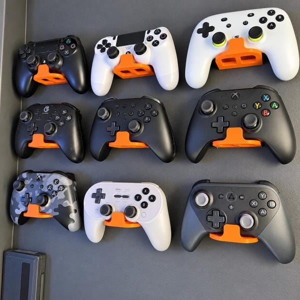 Universal Game Controller Wall Mount. Turn any of your old controllers into stylish wall decor! Multiple Color Option, World Wide shipping.