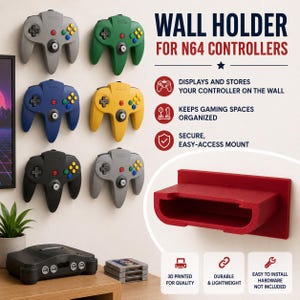 以下が含まれることがあります： 赤色のN64コントローラー用壁掛けホルダー。6つのカラフルなゲームコントローラーが展示されています。「WALL HOLDER FOR N64 CONTROLLERS」と書かれています。このホルダーは、コントローラーを展示し、保管し、ゲームスペースを整理するように設計されています。