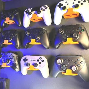 Universelle Wandhalterung für Game Controller - Stilvolle Wanddekoration in mehreren Farben - Einfache Installation, Organisation und Dekoration - Perfekt für Gamer.