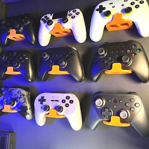 Universal Game Controller Wall Mount - Stylish Wall Decor in Multiple Colors- Easy Install, Organize, and Decorate- Perfect for Gamers.