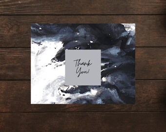 May include: A thank you card with an abstract design in shades of black, white, and gray. The card features a square with the words "Thank You!" in elegant script.