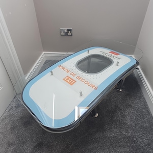 Coffee Table Crafted from an Upcycled Airbus A320 Aircraft Emergency Exit Door
