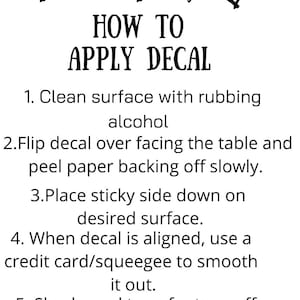 May include: A white instructional card featuring black text that reads: HOW TO APPLY DECAL, followed by five numbered steps for application, and decorated with small black hand-drawn heart icons at the top and bottom of the page.