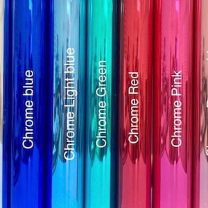 May include: A collection of nine vertical strips of metallic chrome foil in various colours, including black, silver, blue, light blue, green, red, pink, rose gold, and gold. Each strip is labelled with its corresponding colour name in white text.