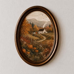 May include: An oval-framed painting depicting a rural autumn landscape with a white cottage, a winding dirt path, and orange pumpkins in the foreground. The scene features golden trees, a mountain backdrop, and a chimney emitting smoke.