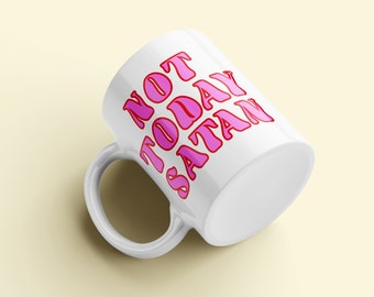 May include: White ceramic mug with a pink outline and the text "NOT TODAY SATAN" in pink.