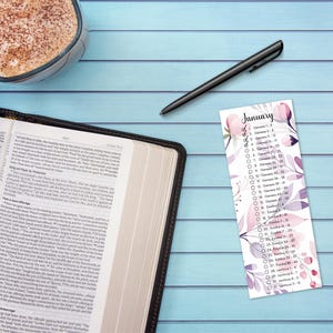 May include: A printable Bible reading plan for January with a floral design. The plan includes daily readings from Genesis, Exodus, and Leviticus.