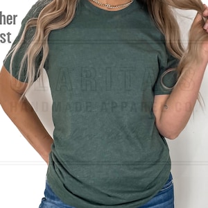 May include: A heather forest green t-shirt with a crew neck and short sleeves. The shirt is made of a soft, comfortable fabric and has a relaxed fit.