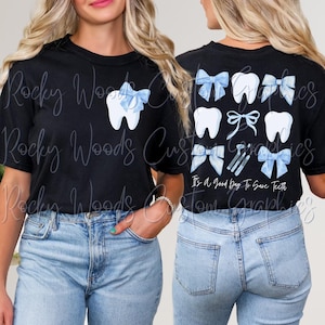 May include: Two black t-shirts with a blue and white tooth design and blue bows. The back of one shirt says "It's a good day to save teeth".