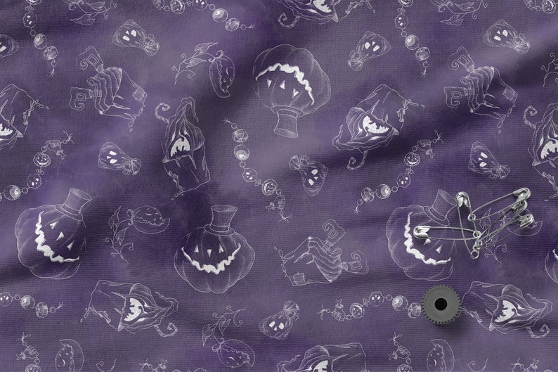 May include: Purple fabric with a white repeating pattern of jack-o'-lantern faces, vines, and strings of beads. The fabric is textured and has a slightly distressed look.