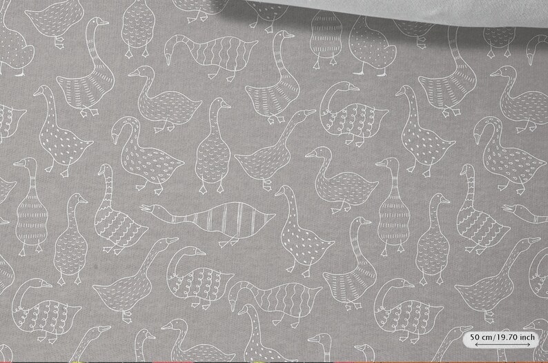 May include: A gray fabric with a white repeating pattern of geese. The geese are stylized and have different patterns on their bodies. The fabric is 50 cm (19.70 inches) wide.
