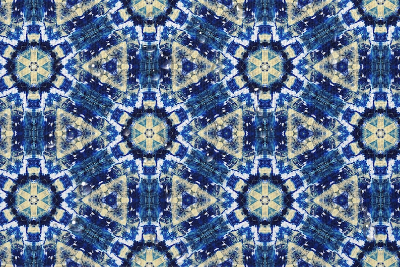 May include: A blue and white patterned design with a kaleidoscope effect. The pattern is made up of geometric shapes and swirls. The background is a light blue color.
