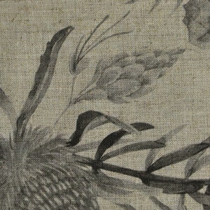 May include: A black and white floral print on a textured linen fabric. The print features stylized flowers and leaves.