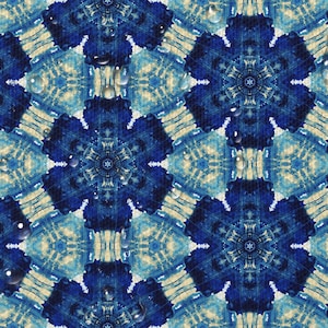 May include: A blue and white patterned background with a repeating geometric design. Water droplets are scattered across the surface.