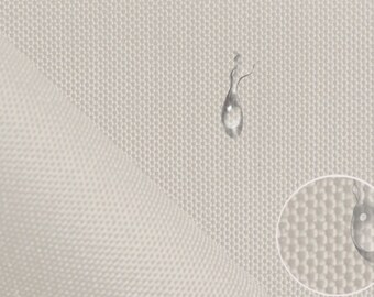 May include: Close-up of a white fabric with a textured surface. Water droplets are on the fabric, demonstrating its water-resistant properties.