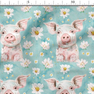 May include: A seamless pattern featuring watercolor illustrations of pink piglets with white spots on a light blue background. The piglets are surrounded by white flowers with yellow centers and small white dots.