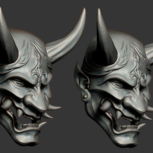 May include: Two silver-colored Japanese Oni masks with horns and intricate details. The masks have a fierce expression with sharp teeth and a detailed design.