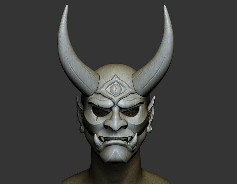 May include: A white, detailed, 3D printed mask with horns, a third eye, and a fierce expression. The mask is a traditional Japanese Oni demon mask.
