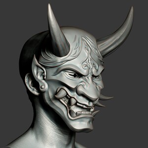 May include: A detailed, gray, 3D model of a Japanese Oni mask with horns, intricate details, and a fierce expression.