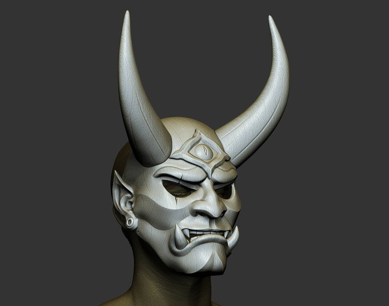 May include: A white, detailed, sculpted mask with horns, a third eye, and a fierce expression. The mask is worn on a bald head with a single earring.