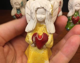 Handmade Ceramic Angel Figurine Holding Red Heart – Yellow Glazed Miniature Angel Statue – Unique Guardian Angel Gift – Spiritual Home Decor