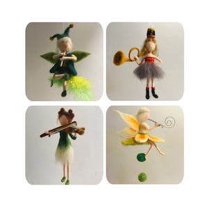 May include: Four felt fairy figurines, each playing a different instrument. The first fairy is playing a flute, the second is playing a trumpet, the third is playing a violin, and the fourth is playing a recorder.