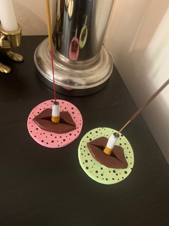 cigarette incense holder We have NEW holders in the work and will be releasing soon! But for now, here is a little throw back  hand wash only DIMENSIONS 70 x 70 x 40 mmdia 2.7 x 1.5 inches MATERIAL Borosilicate Laboratory GlassEvery care is taken to package our glass securely Kitsch Pink Lime Spotty Incense