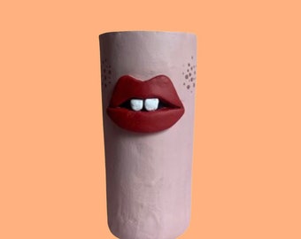 Freckled face quirky weird pen pot red lips