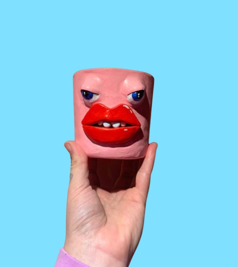 Quirky strange head face pot pink eyes and lips weird art image 1