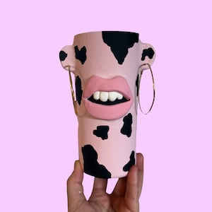 Quirky cow print mouth pot pink and black with earrings and lips