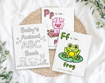 May include: A black and white illustrated book cover for a baby's animal alphabet book. The cover features the title "Baby's Animal ABC Book" and illustrations of a tiger, elephant, and rabbit.