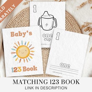 May include: A printable 123 book for babies featuring a sun with a smiling face and the text "Baby's 123 Book". The book includes a matching page with a picture of a cup and the text "one cup".