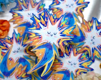 May include: A collection of star-shaped stickers featuring a central white face with closed eyes and a smiling mouth. The star points are decorated with vibrant streaks of blue, yellow, orange, and red, creating a dynamic, colorful burst effect.