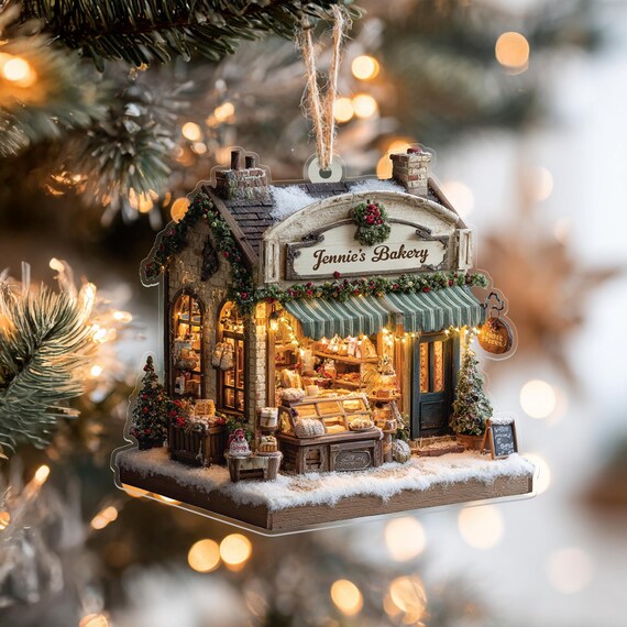 A personalized acrylic ornament styled like a cozy vintage bakery sign — the kind of hyper-specific gift that makes a baker feel truly *seen*.