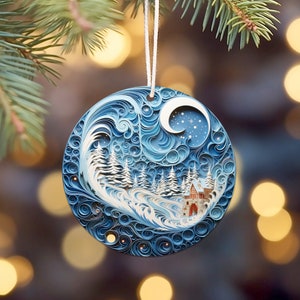 May include: A blue and white paper quilling ornament depicting a winter scene with a small house, trees, and a crescent moon. The ornament is round and has a white string for hanging.