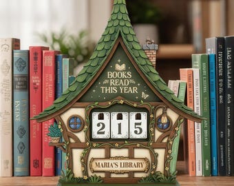 May include: A wooden cottage-shaped calendar with a green roof and the text "BOOKS READ THIS YEAR." The calendar shows the number 215 and has "MARIA'S LIBRARY" on a sign. Books are arranged in the background, creating a library scene.