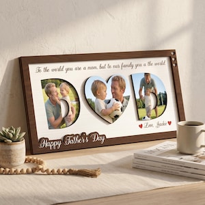 May include: A wooden photo frame with the word "DAD" cut out, displaying three family photos. The frame includes the text "Happy Father's Day" and "Love, Jackie." The frame is brown with a white background and heart-shaped cutouts.