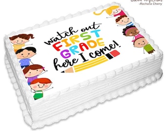 May include: A white cake with a colorful edible image of children and the text "Watch out First Grade here I come!"