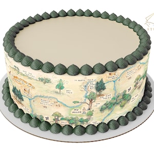 May include: Round cake with a light tan top and a map design on the sides. The map is a watercolor illustration with green and brown accents. The top and bottom edges are decorated with green frosting.