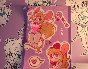 May include: A purple sticker sheet featuring cartoon mouse illustrations in various poses. The stickers have a pink and red color scheme, with hearts and a wrench graphic. The mouse has long blonde hair and is wearing a swimsuit.