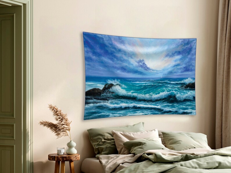 May include: A tapestry featuring a seascape with blue and green waves crashing against rocky shores. The sky is a mix of blue and gray with white clouds. The scene is reminiscent of a stormy day at sea.