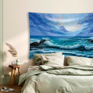 May include: A tapestry featuring a painting of a stormy sea with large waves crashing against rocky shores. The sky is a mix of blue and gray with a hint of pink in the clouds.