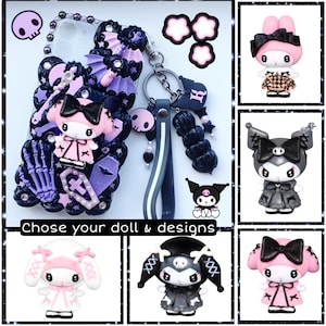 May include: A phone case with a black and purple design featuring a skull, a cross, and a coffin. The case has a black and white strap with a charm. The image also shows three different character options for the case: a pink character with a black bow, a black character with a black bow, and a pink character with a black bow.