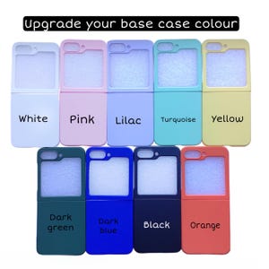 May include: A selection of phone cases in various colors, including white, pink, lilac, turquoise, yellow, dark green, dark blue, black, and orange. The cases are all designed for a foldable phone and have a clear window on the front.