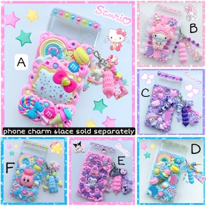 May include: Six different phone cases decorated with colorful 3D embellishments, including candy, stars, and cartoon characters. The cases are all clear and have a Sanrio logo on them. The text "phone charm & lace sold separately" is written below the cases.