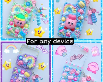 May include: Four phone cases featuring a pink and blue pastel color scheme with a cartoon character named Kirby. The cases are decorated with various 3D embellishments, including candy, hearts, stars, and rainbows. The text "For any device" and "Kirby" are visible on the cases.