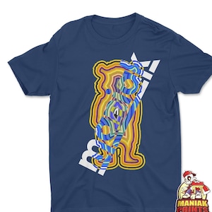May include: A navy blue t-shirt with a white graphic of a colorful bear with the word "maniak" printed diagonally across the bear. The word "maniak" is in white and the bear is made up of a variety of colors, including yellow, orange, red, blue, green, and purple.