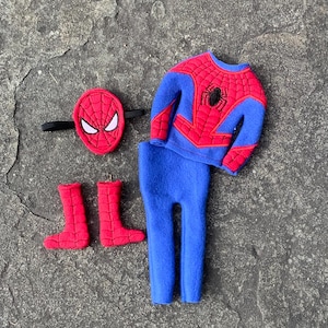 May include: A Spider-Man costume set, featuring a red and blue top, blue pants, red boots, and a red mask with white eye details. The top has a black spider emblem.