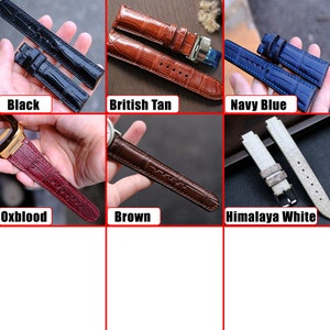 May include: Six different watch straps in various colors, including black, British tan, navy blue, oxblood, brown, and Himalaya white. The straps are made of leather and have a crocodile pattern.