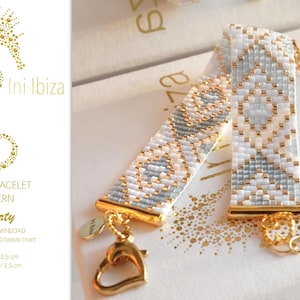 May include: A white and gray beaded loom bracelet with a gold clasp and chain. The bracelet is 12.5 cm long and 1.5 cm wide. The pattern is called "Liberty".